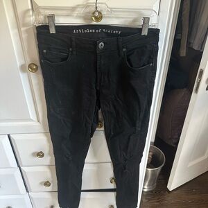 Women’s black ripped skinny jeans